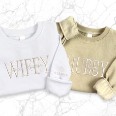 "\"Cherish Love: Custom Mrs Embroidered Sweatshirt for the Perfect Duo!\" 💍 Introducing our 'Custom Mrs Embroidered Sweatshirt,' designed for the perfect pair. This wifey-hubby couple pullover is a celebration of love and togetherness. Whether it's for an engagement, honeymoon, or a bridal gift, this crew neck is the ideal choice. Cherish the union and special moments with this unique and stylish bride sweater, perfect for commemorating love in its most delightful form. Sweatshirt Features: - 5 Long Sleeve Cotton Sweatshirt For Anniversary, Bride Sweater, Bride Hoodie, Mrs Sweatshirt, Stylish Bride, Bridal Gift, Black Thread, Embroidered Sweatshirt, Wedding Outfits