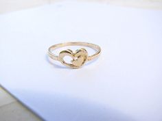 Beautiful two hearts ring. ►Material: 14k gold filled. Please convo me if the size that you need is not available. Click here for more rings https://www.etsy.com/il-en/shop/MoonliDesigns?ref=hdr_shop_menu&section_id=21288938 ► Nickel Free ✔ ► Tarnish Resistant ✔ ► No Allergic reaction ✔ ► 30 days return policy ✔ ► Accept replacements and custom orders ✔ ► I ship all items in a jewelry gift box ✔ ► Greeting card - upon request ✔ Shipping information : ► Tracking number ✔ ► Expedited / Express Gold Heart Ring For Promise, Mother's Day, Dainty Gold Heart Promise Ring, Gold Heart Promise Ring For Mother's Day, Gold Heart Ring For Mother's Day Promise, Gold Dainty Heart Ring For Mother's Day, Delicate Gold Heart Ring For Valentine's Day, Mother's Day Delicate Gold Rings, Gold Double Heart Ring For Mother's Day, Gold Heart Ring For Wedding And Mother's Day