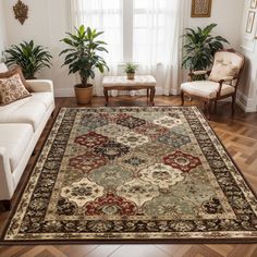 a living room filled with furniture and a large rug