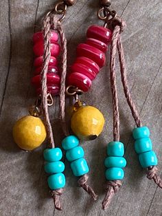 "These beautiful dangle earrings are made with copper ear wires, turquoise blue seed beads on a hemp tassel, red shell beads, amber faceted glass & faceted golden marble beads. The small amber faceted czech glass beads really sparkle! I tried to photograph them at different angles so that you could see how they capture the light. From the top of the ear wire to the bottom measures 2.5\" Please take a few moments to browse through my shop. I have a large selection of unique belt buckles, leat Adjustable Brown Bohemian Tassel Earrings, Bohemian Czech Glass Dangle Jewelry, Beach Jewelry With Brown Tassels, Hippie Style Red Jewelry For Gift, Czech Glass Beaded Drop Earrings, Handmade Adjustable Bohemian Tassel Earrings, Summer Brown Tassel Jewelry, Colorful Beads Dangle Tassel Earrings For Beach, Adjustable Dangle Beaded Earrings Hippie Style