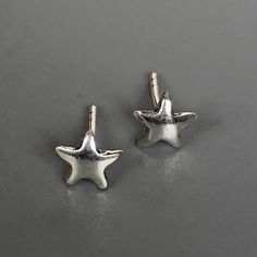 A PAIR of tiny sterling silver star ear studs. Size: 5 x 5 mm. Weight: 0.46gm Price listed is for a PAIR of studs. These earrings are made of 925 hypoallergenic sterling silver Can be packaged in a gift box. I can include a personal message from you if needed You are welcome to contact me at... bhavnakwintra1956@gmail.com For more beautiful pieces from my shop, please browse 👇 TOE RINGS: https://www.etsy.com/your/shops/TheSilverGame/tools/listings/section:27020628,view:table EAR HOOPS: https:// Minimalist Silver Star Cartilage Earrings, Silver Star-shaped Dainty Cartilage Earrings, Dainty Silver Star Cartilage Earrings, Nickel Free Star Shaped Silver Cartilage Earrings, Tiny Silver Star Cartilage Earrings, Earrings Cartilage, Tragus Stud, Cartilage Stud, Star Studs