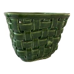 a green basket is shown against a white background