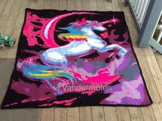 a rug with a unicorn on it sitting on the floor