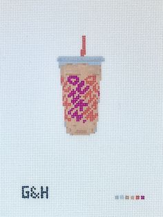 a cross - stitch picture of a coffee cup with a straw in it and the words goh written below