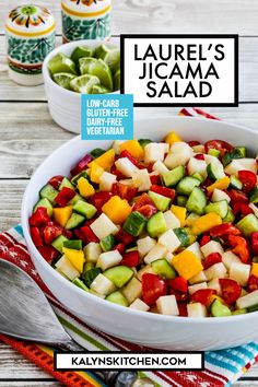 a bowl filled with chopped vegetables on top of a table next to two bowls of pickles