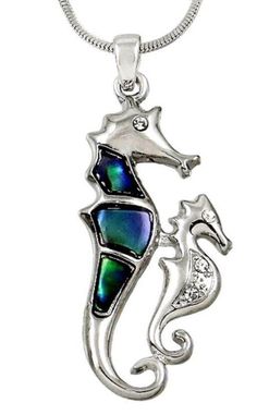 a pendant with a sea horse on it