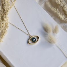 "This evil eye initial pendant is a very modern looking yet classic piece that can be carried for many years. It is a light piece with a 3D shape in the front and flat at the back. This makes it sit comfortably on the neck, does not turn back while you move.  It can be personalized with any letter you like.  This piece is handmade by experienced artisans of the Grand Bazaar in Istanbul. Evil eye charms have been a popular gift to friends for their birthday, wedding, anniversary, bar mitzvah and all similar occasions. It can be a perfect self-gift as well!  Being thought of by your loved ones really matter especially when you get sick. So you can consider this as a wonderful \"get well soon gift\" as well... The charm initial is crafted from high-quality 925 sterling silver and 14 K gold pl Minimalist Eye-shaped Jewelry Gift, Elegant Evil Eye Necklace For Gift, Elegant Evil Eye Necklace Gift, Luxury Symbolic Evil Eye Necklace, Yellow Gold Evil Eye Pendant Necklace, Fall Wedding Gifts, Evil Eye Enamel Jewelry Gift, Spiritual Metal Evil Eye Necklace, Gold-plated Evil Eye Amulet Necklace