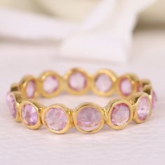 Pink Sapphire Full Eternity Band, September Birthstone Pink Sapphire Band , Sapphire Stacking ring, Wedding band, Anniversary Gift For Her [{"Description"}] Main Gemstone- Name- Pink Sapphire (Lab Created) Shape - Round Stone Color - Pink Birthstone- September Add this beautiful Ring in your accessories to make you feel unique.  You can select any size you want from drop down menu.  We Accept Custom Order and Bulk Order Also, Feel free to contact me for any queries regarding custom or bulk order Wedding Eternity Band With Halo Setting, Stackable Round Sapphire Ring For Anniversary, Wedding Eternity Band With Halo Setting And Round Cut, Round Cut Eternity Band With Halo Setting For Wedding, Round Cut Halo Setting Eternity Band For Wedding, Pink Gemstone Eternity Band For Anniversary, Round Gemstone Eternity Band For Anniversary, Elegant Faceted Stackable Rings For Wedding, Fine Jewelry Faceted Stackable Rings For Anniversary