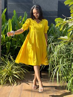 This sunshine yellow midi dress brings an instant pop of brightness with its vibrant hue. Featuring puffed sleeves and a relaxed tiered silhouette, it's designed for effortless style and all-day comfort. Ideal for warm days and fun outdoor moments! Please provide your phone number in the Note at checkout so the courier can get in touch with you if needed. SIZE XS bust: fits bust around 32" / 81cm Waist: fits waist around 26" / 66cm SIZE S bust: fits bust around 34" / 86cm Waist: fits waist aroun Yellow Cotton Dress, Dress Puff Sleeve, Yellow Midi Dress, Puff Sleeve Dress, Sunshine Yellow, Dress Yellow, Dress Cotton, Puffed Sleeves Dress, Puffed Sleeves