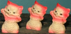 three little kitten figurines sitting next to each other