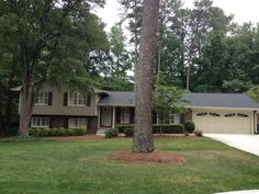 a large house in the middle of some trees