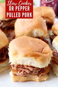 slow cooker pulled pork sandwiches on a plate with text overlay that reads slow cooker pulled pork