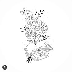 an open book with flowers in it