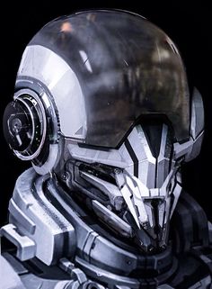 a close up of a robot wearing a helmet