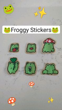 froggy stickers are on the counter next to some mushrooms and toadies with stars