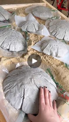 someone is making something out of clay on the table and it looks like they have been made