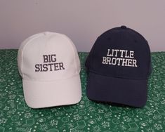 Set of two low profile baseball hats for kids, toddlers or babies | Machine embroidery | Matching hats -----The price is for two embroidered caps----- In three sizes: kids, toddlers and babies KIDS BASEBALL CAP (adjustable): 100% Cotton Twill Rip-Strip™ size adjuster Child safe secure button Stitched ventilation eyelets 5 panel design Pre-curved peak TODDLERS BASEBALL CAP (adjustable): 6 Pan Baseball Cap garment wash Unstructured front panels Curved visor Closure with slide buckle 6 sewn eyelets Brother Machine Embroidery, Big Sister Little Brother, Hats For Kids, Kids Baseball Caps, Matching Hats, Baseball Baby, Kids Baseball, Embroidered Caps, Little Brother