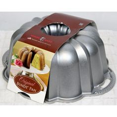 a bundt cake pan with a card on the front and inside that says, original bundt tan