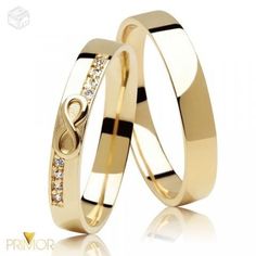 two gold wedding rings with diamonds on them