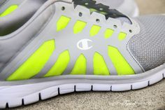 a pair of running shoes sitting on the ground