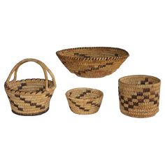 three woven baskets with handles on each side and one basket in the middle, all lined up