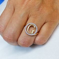 Our Cutoff Date for Christmas delivery is Sunday Dec. 13, 2020All Order placed after this date will be completed for mid January delivery.A completely customizable ring with your choice of initial, in your choice of 14k yellow, rose, or white gold, and also choice of chain length! **FREE SHIPPING**Features:~14k Yellow Gold ~This Ring weighs Approximately 3.0 Grams (will vary slightly with initial)~The Initial with the Diamond Halo measure 0.575 inch in diameter ~This ring has 28 Full brilliant c Luxury White Gold Initial Ring With Single Diamond, Luxury Engagement Ring With Initials, White Diamond Initial Ring For Anniversary, Personalized White Diamond Ring, Round Diamond Ring With Initials For Anniversary, White Diamond Initial Ring As Gift, White Diamond Initial Ring For Gift, Anniversary Cubic Zirconia Rings With Initials, Gift Initial Ring With Brilliant Cut