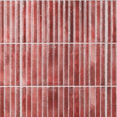 a red tiled wall with vertical lines on it