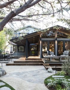 a house that is surrounded by trees and plants