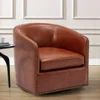 a brown leather chair sitting on top of a hard wood floor next to a table