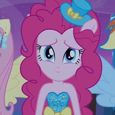 two pinkie ponies standing next to each other