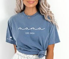 This Mama shirt with kids' names is perfect for any mama who wears her heart on her sleeve. Makes a great Mother's Day Gift for a new mom or new Grandma! Customize with any saying, (Mom, Gigi, Nana Etc.) and est. year. Customize with kids' names on sleeve. Featured on a short sleeve Comfort Color tee. ✨ HOW TO ORDER ✨ ✧ Select Options from the Drop Downs ✧ Record personalization requests ✧ ADD TO CART 🎨 GRAPHIC DETAILS 🎨 ► Professionally and Permanently Printing Process ► Vibrant and Accurate Casual Personalized Tops For Mother's Day, Personalized Blue Short Sleeve Tops, Personalized Casual Tops For Mother's Day, Custom Name Cotton T-shirt With Short Sleeves, Casual Blue Shirt For Family Occasions, Family Long Sleeve T-shirt For Mother's Day, Custom Name Short Sleeve Tops For Gifts, Personalized Tops For Mother's Day, Long Sleeve T-shirt For Mother's Day Family Event