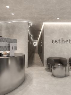 the interior of an office with chairs, desks and a sign that says estheton