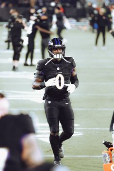 a football player is running on the field