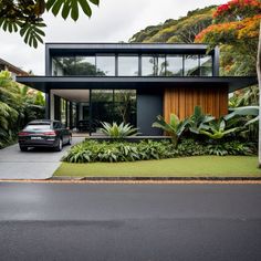 a car parked in front of a modern house