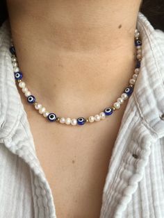 Evil eye beads with Freshwater pearls and space beads with a gold finish. Beaded Evil Eye Necklace, Evil Eye Necklaces, Evil Eye Jewellery, Beaded Evil Eye, Evil Eye Beads, Williamsburg Va, Crafts Jewelry, Eye Beads, Diy Crafts Jewelry