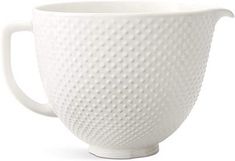 a white coffee cup with a handle on it