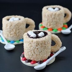 rice krispy kreme mugs with marshmallows and candy on them