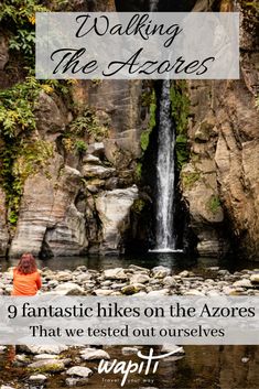 a woman sitting on rocks in front of a waterfall with text overlay reading walking the azures 9 fantastic hikes on the shores that we tested out ourselves