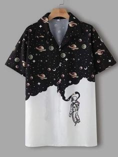 an astronaut shirt hanging on a hanger with space and planets all over it's surface