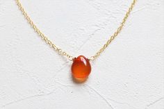 Crystal necklace of carnelian, perfect gift for bridesmaid, friends and family members. Size of pendant: about 10x12mm Length of necklace: Can be chosen from 14-30 inches ------------------------------------------------ Necklace and component options: ▲ 14 k gold filled ▲ 18 k gold plated brass base ▲ Silver plated brass base ▲ Antique plated brass base ------------------------------------------------ The price is for one necklace. Please kindly understand that every crystal is natural and they Gold Chalcedony Jewelry As A Gift, Gold Carnelian Jewelry For Wedding, Gold Teardrop Agate Necklace, Elegant Carnelian Round Pendant Necklace, Gold Carnelian Crystal Necklace Gift, Gold Carnelian Crystal Necklace As Gift, Elegant Carnelian Crystal Necklace Gift, Elegant Carnelian Crystal Necklace For Gift, Carnelian Crystal Necklace Gemstone As Gift