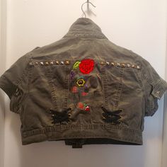 Super Dope Army Fatigue Denim Cut Off Jacket With Beautiful Intricate Skull On The Back. Paches On The Front And Studded. It Zips Up And Buckles. It Says Large But Definitely Womens S/M. Never Worn. Functional Pockets Fitted Punk Denim Jacket With Pockets, Distressed Cotton Outerwear For Festival, Fitted Festival Outerwear With Pockets, Fitted Outerwear With Pockets For Festivals, Casual Cotton Denim Jacket For Alternative Fashion, Casual Denim Vest For Fall Festival, Skull Jacket, Army Fatigue, Upcycle Clothes Diy