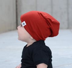 Our brick-red color beanie is soft and silky feeling! This beanie has a slouch to it also, It's 95% rayon 5% spandex. This item is handmade and perfect for girls or boys Sizes Small newborn-6 months Medium 6-12 months Large 1-2 year XL 2-10 Xl width 19in length 9in L width 18 in length 8in M width 16in length 8in S width 14in length 7in Width is measured for the head size Item listed only, no accessories included Wash with dark colors and gentle dry on low Red Beanie One Size Fits Most, Casual Red Bonnet, One Size Fits Most, Casual Red Bonnet One Size Fits Most, Casual Red Bonnet, Playful Red Beanie Hat, Cute Red Beanie Hat, Hipster Beanie, Orange Hat, Orange Hats