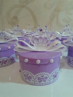 there are many purple boxes with tiaras on them