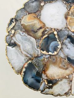 an abstract piece of art made out of agate and gold