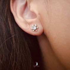 These cute dainty snowflake stud earrings features tiny snowflake design with cubic zirconia gemstone. Add these cute snowflake stud earrings to your holiday jewelry collection or as gift for your love one this holiday season. Elevate your holiday ensemble with these elegant stud earrings featuring a delicate snowflake design and sparkling cubic zirconia gemstone. Give the gift of subtle sophistication this season with these must-have snowflake studs. Materials: 925 sterling silver, cubic zircon Cubic Zirconia Snowflake Earrings For Gift, Silver Snowflakes, Snowflake Designs, Holiday Jewelry, Sterling Silver Studs, Sterling Silver Earrings Studs, Silver Studs, Silver Earrings Studs, Jewelry Care