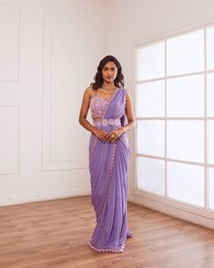 Lavender embellished blouse with pre draped saree having hand embroidered border and detatchable belt. Lavender pre draped saree with belt No. of pieces in a set: 3 Color: Lavender Fabric Composition: Opada silk, georgette, organza Lining Material: Shantoon Closure used: Back hook in blouse and side zip in saree. Dress Length : Full Silhouette: Saree Neck type : Strapped Sleeve Length: Sleeveless Waistline: High waist Prints/ Pattterns : Plain Delivery Time: 20-25 days Purple Embellished Pre-draped Saree, Embellished Purple Pre-draped Saree, Purple Anarkali Pre-draped Saree For Reception, Purple Pre-draped Saree With Cutdana For Reception, Purple Embellished Georgette Pre-draped Saree, Purple Floor-length Pre-draped Saree For Reception, Purple Georgette Pre-draped Saree For Evening, Purple Silk Pre-draped Saree For Reception, Purple Georgette Pre-draped Saree