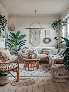 a living room filled with furniture and plants