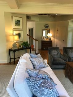 a living room filled with furniture and decor