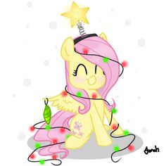 a little pink pony sitting on top of a pile of christmas lights next to a star