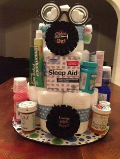 a cake made to look like a diaper with lots of items on top of it